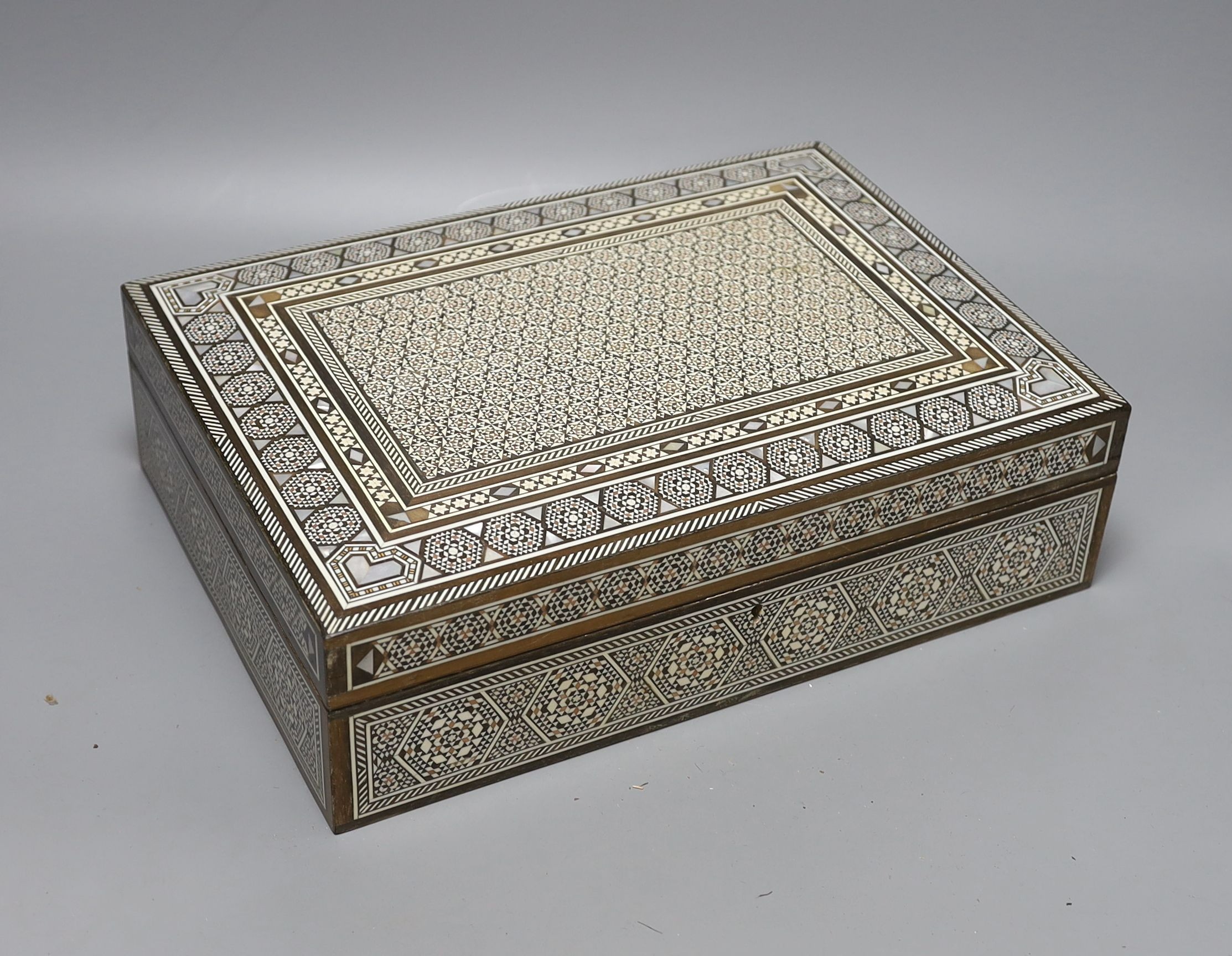 A Damascus jewellery casket and a pair of Victorian candlesticks, 43cm tall